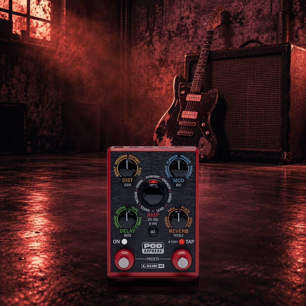 POD Express Guitar pedal in a grungy garage with an offset guitar and fuzzy amp