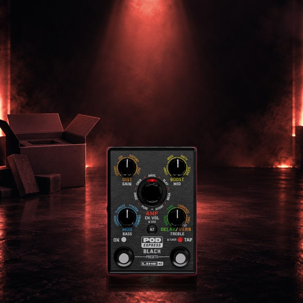 POD Express Black pedal on a dark floor under a warm spotlight