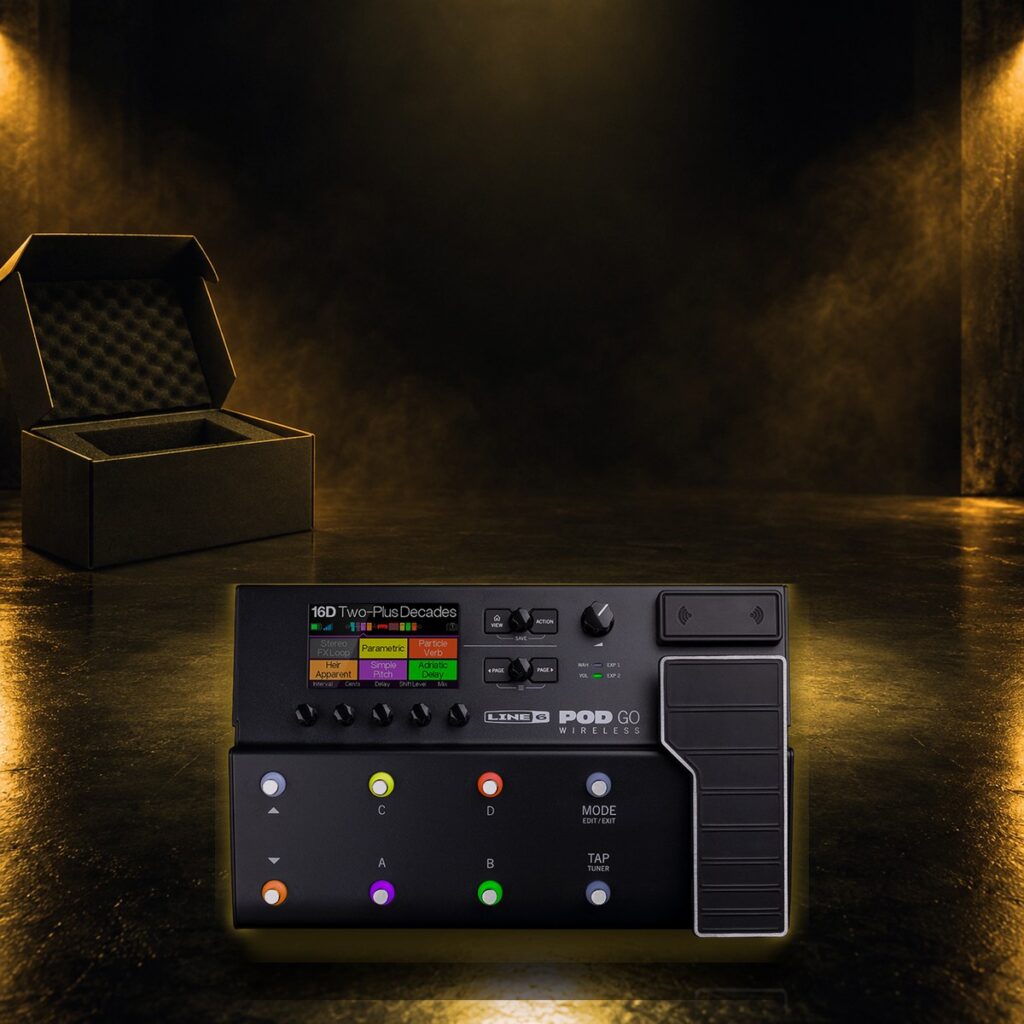 New mid-size floor multi-effects unit resting in its open box under an orange spotlight