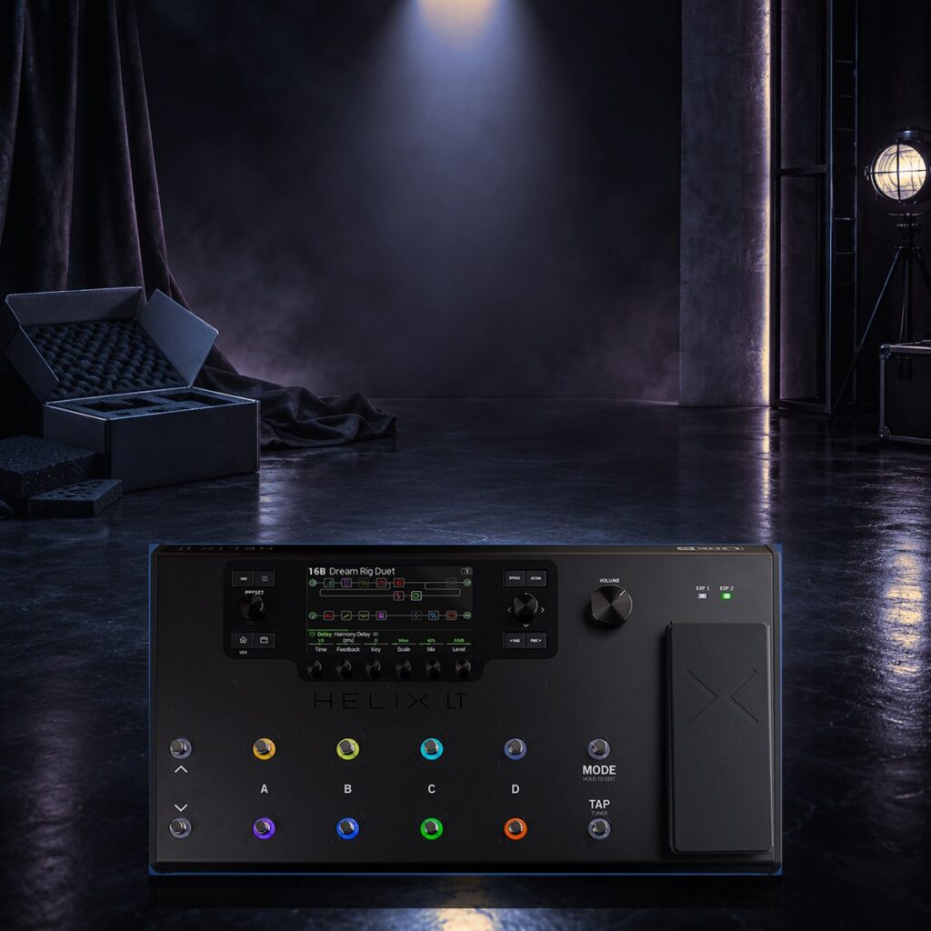 New black floor multi-effects processor lying in its open box under an orange spotlight
