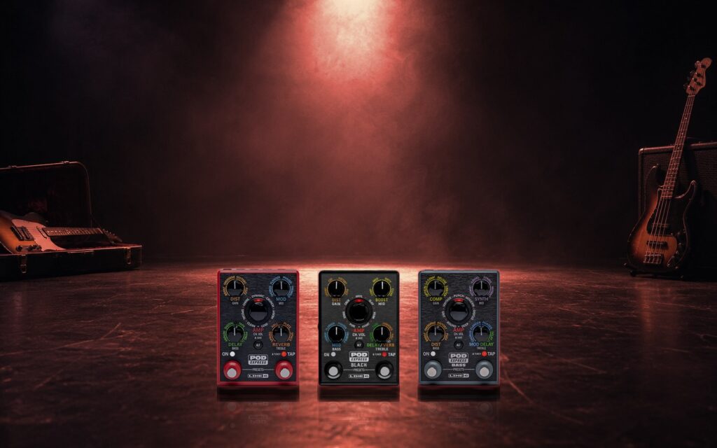 The three POD Express pedals, Guitar, Black and Bass, side by side on a stage floor