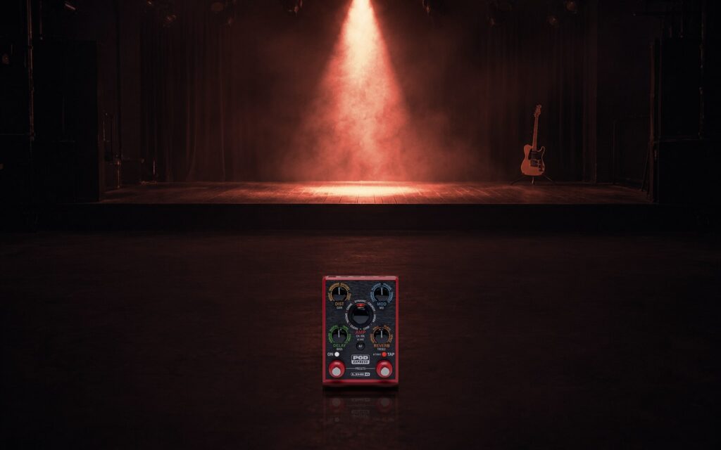 A POD Express pedal alone under a spotlight on an empty stage