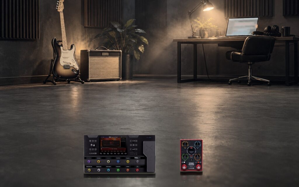 A home studio with a guitar, an amp and a laptop, with a Helix Stadium and a POD Express on the floor